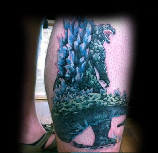 Colorful Godzilla Tattoo With Detail On Guys Calf