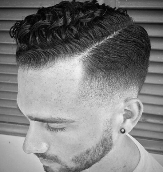 Comb Over Curly Taper Fade Hairstyle For Men
