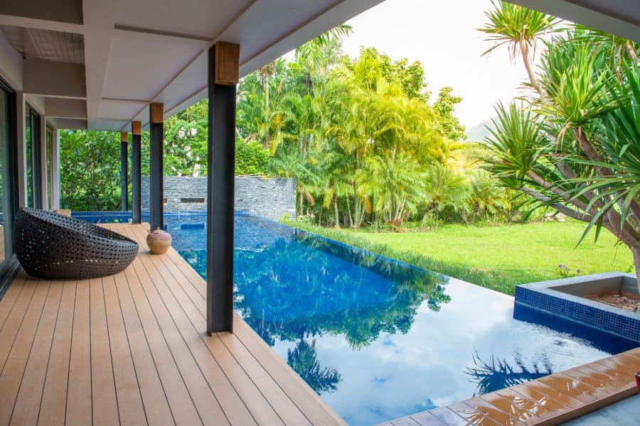 resort style infinity pool with wood deck 