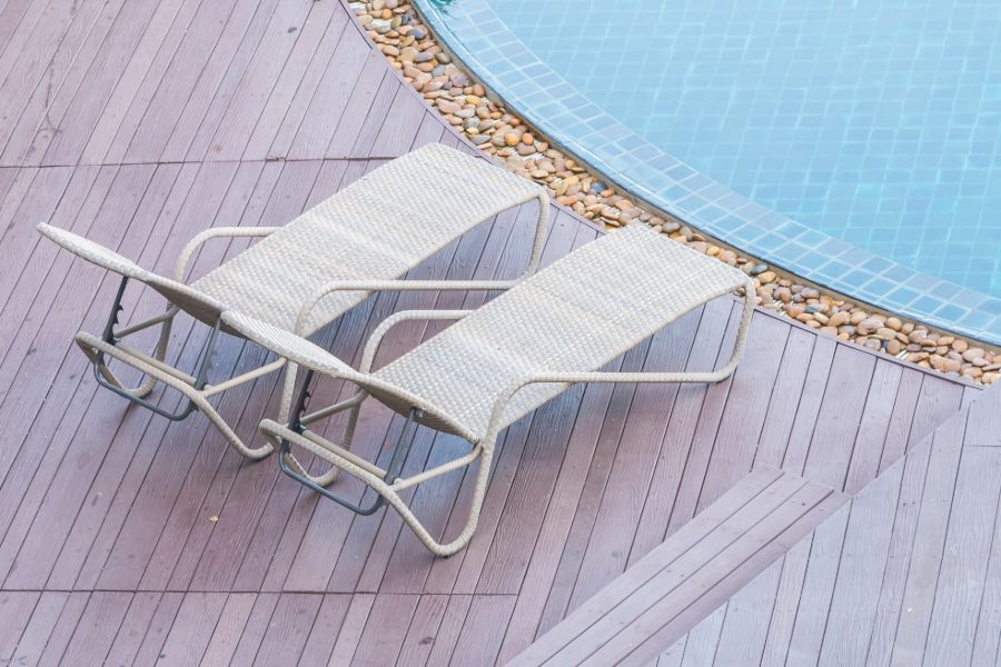 wood deck sun loungers pool