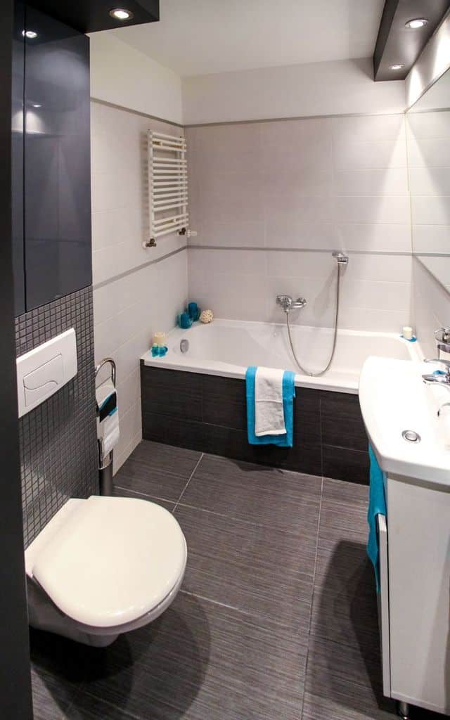 modern bathroom with gray tiles and bathtub 