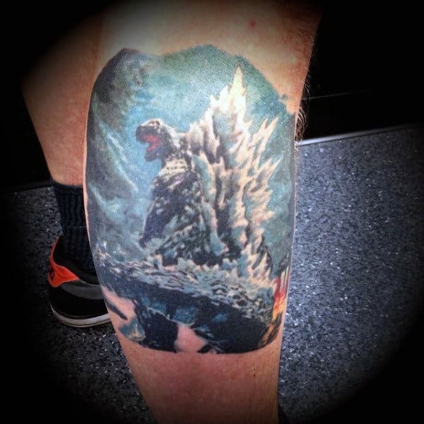Cool Blue Godzilla With Spikes Tattoo On Guy