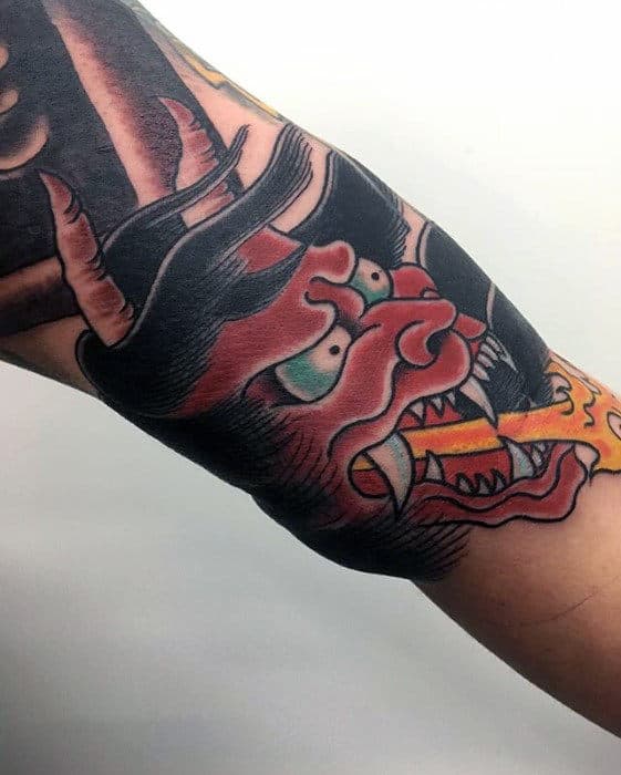 Cool Hannya Japanese Demon Mask Breathing Fire Tattoo On Guys Inner Arm Bicep