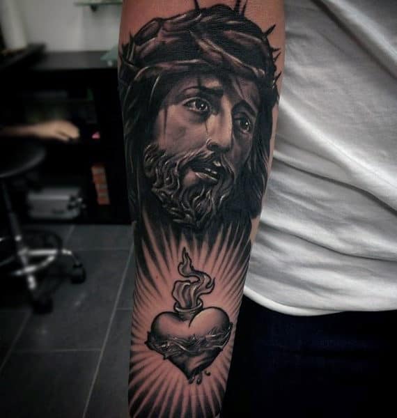 Cool Heart With Jesus Portrait Male Forearm Tattoo Design Ideas