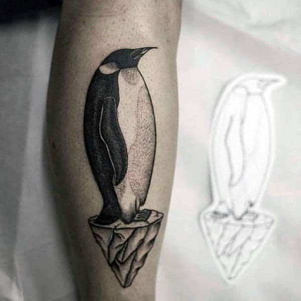 Cool Leg Tattoo For Men Of Penguin Standing On Melted Ice