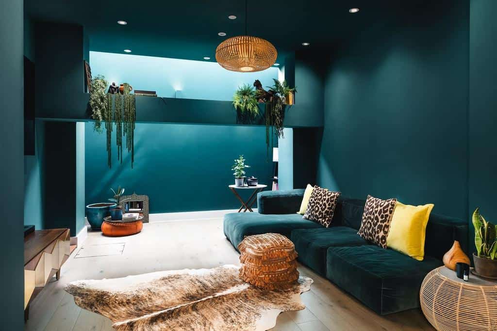 cool aqua blue living room with hanging plants 