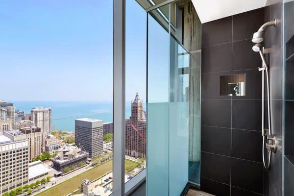 luxury apartment shower with black tiles 