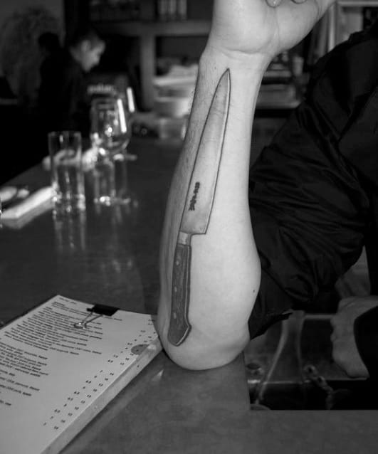 Cool Mens Resturant Inspired Chef Knife Tattoo On Outer Forearm