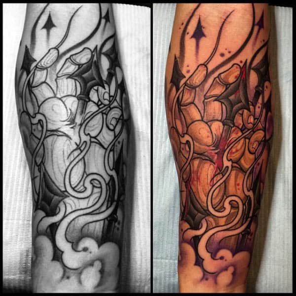 Cool Mens Spear Through Hand Tattoo On Forearms