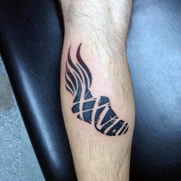 Cool Negative Space Running Shoe With Flames Male Leg Calf Tattoo