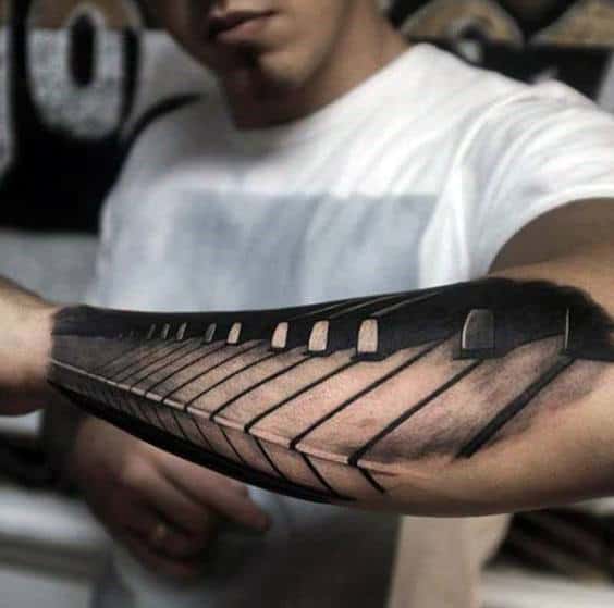 Cool Piano Keys Forearm Tattoo For Men With Realistic Design