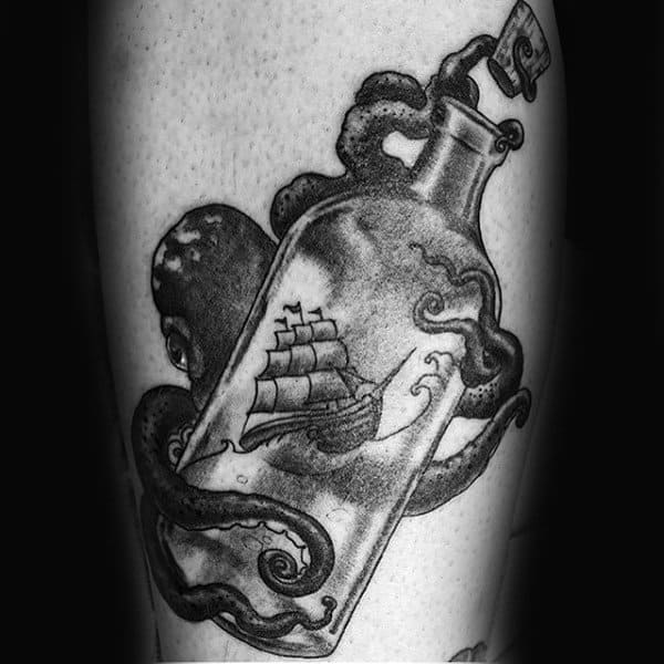 Cool Ship In A Bottle With Octopus Wrapped Around Glass Mens Arm Tattoo