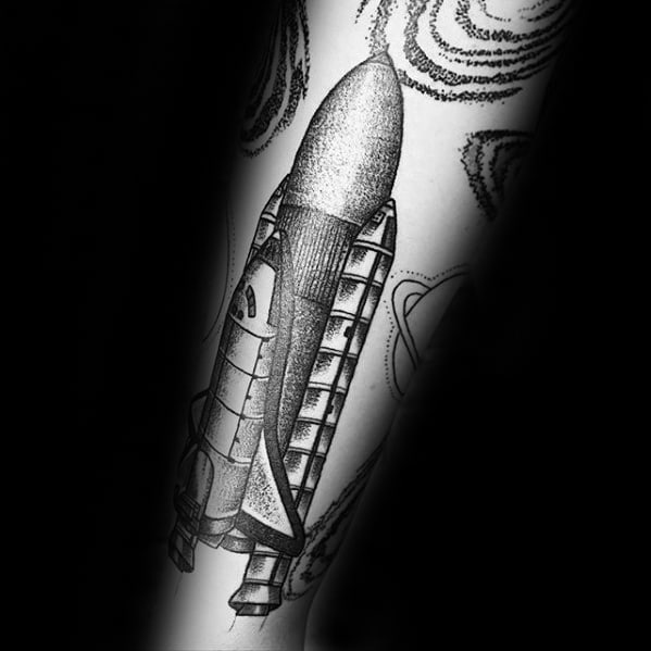 Micro-realistic space shuttle tattoo located on the