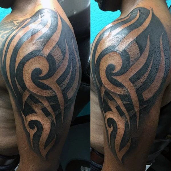 Cool Tribal Arm Tattoos Guys With Negative Space Design