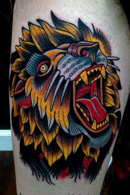 cool-yellow-growling-traditional-lion-mens-thigh-tattoos