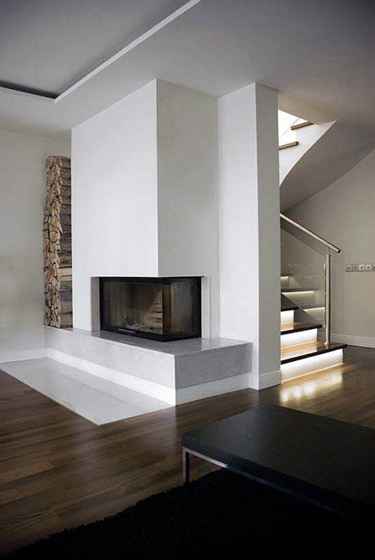 Corner Fireplace Design With Built In Firewood Storage Area