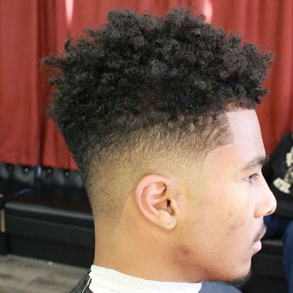 Long styled hair and medium fade on the back and sides