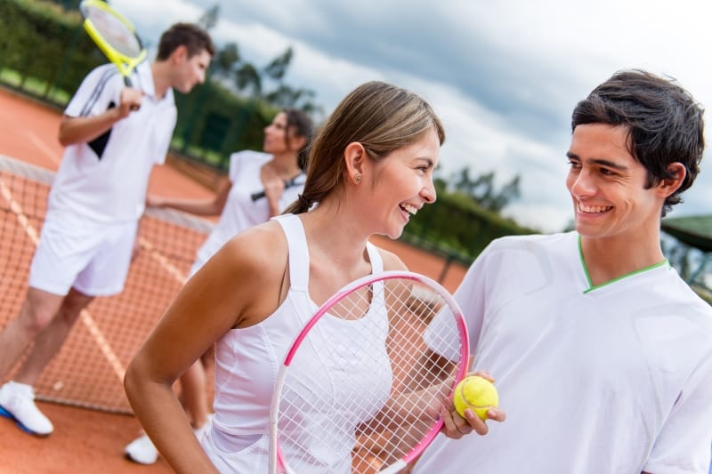 couple play tennis