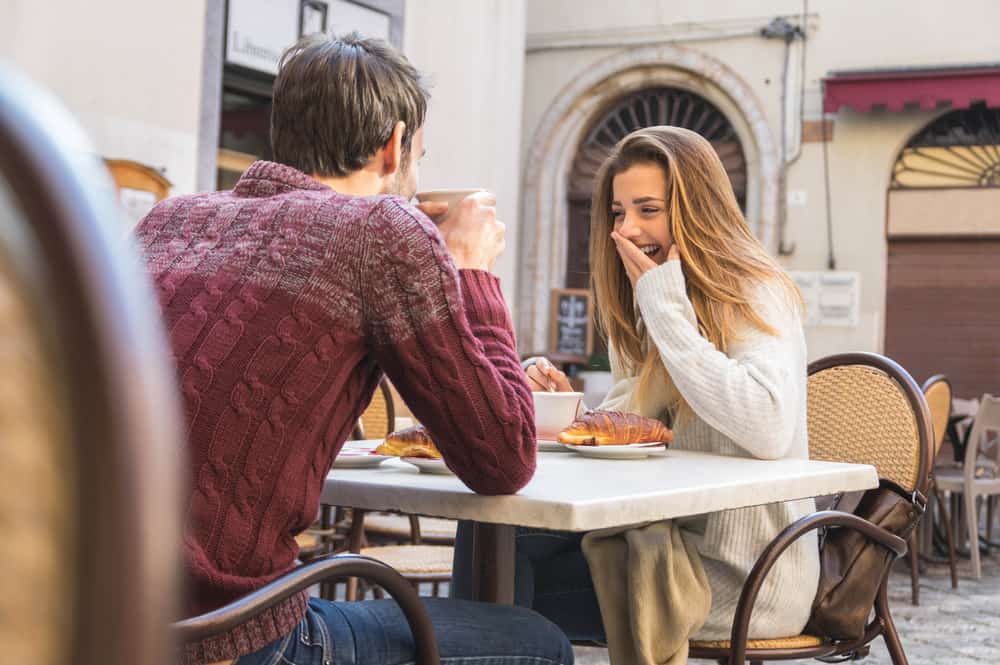 couple talking coffee shop