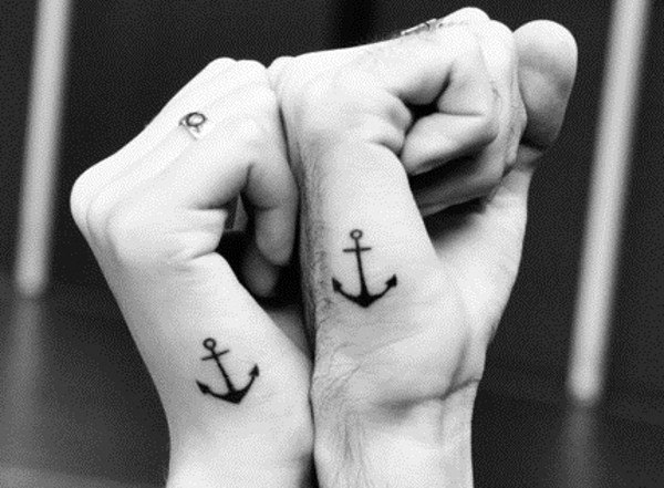 Couple Tattoos Small Anchors On Side Of Hands