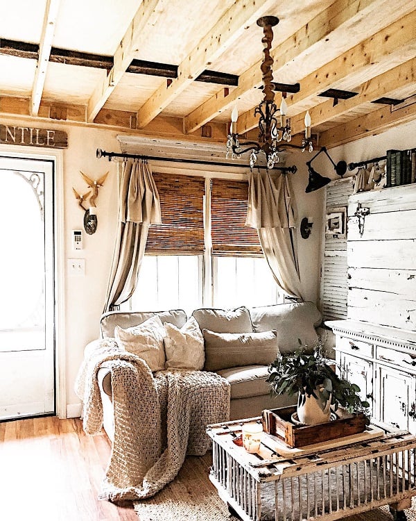cozy cottage unfinished ceiling gray sofa