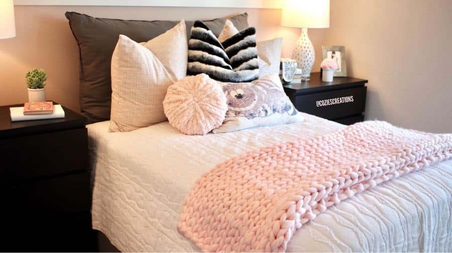 cozy bedroom black bedside tables pink throw rug