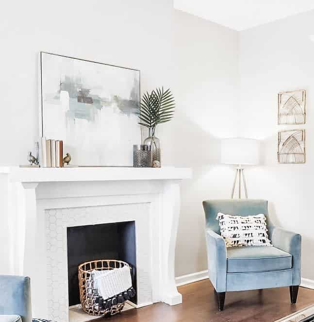 cozy home white fireplace blue accent chair 