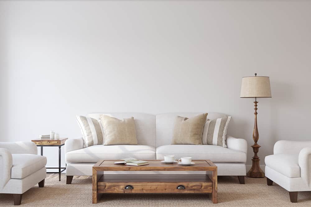 simple living room white sofa wood coffee table vintage floor lamp