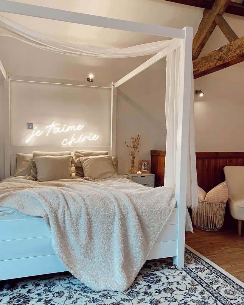 white four post bed exposed wood ceiling beams neon sign 