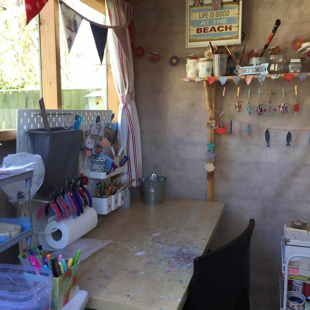 sparse craft room in she shed