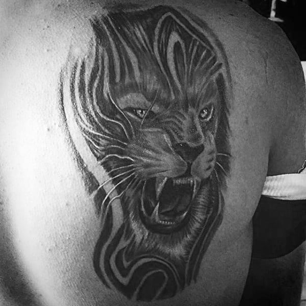 Creative Lion Back Tattoo On Man