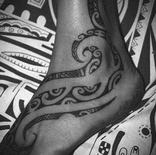Creative Negative Space Hawaiian Tribal Male Foot Tattoo