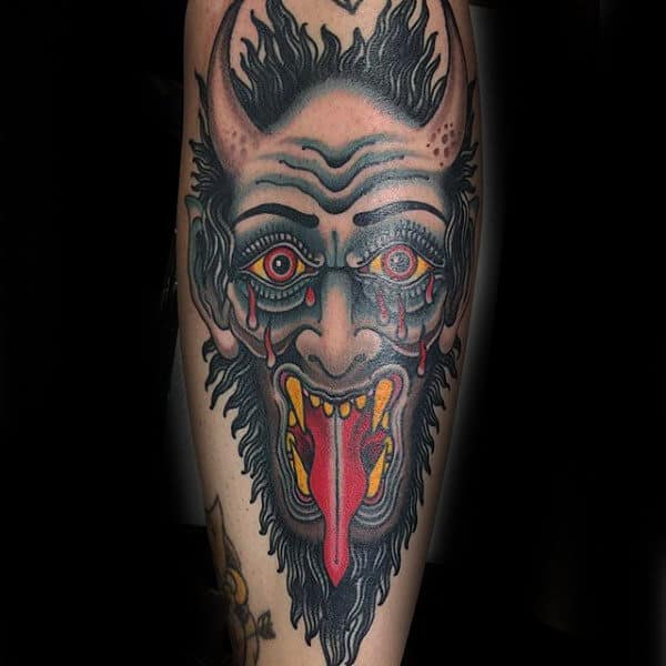 Creative Shin Tattoo Of Demon On Male
