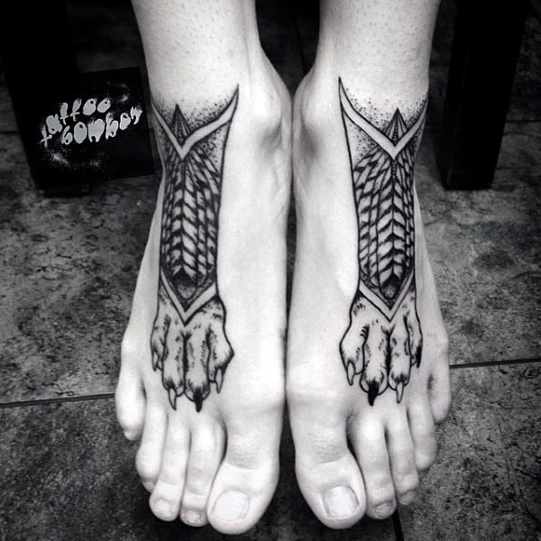 Creative Tattoo Of Wolf Paw Legs On Mans Foot