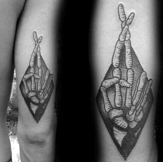 Crossed Skeleton Hand Fingers Mens Good Luck Tattoo Design Inspiration