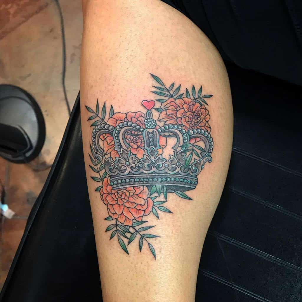 Crown marigold tattoo upper arm