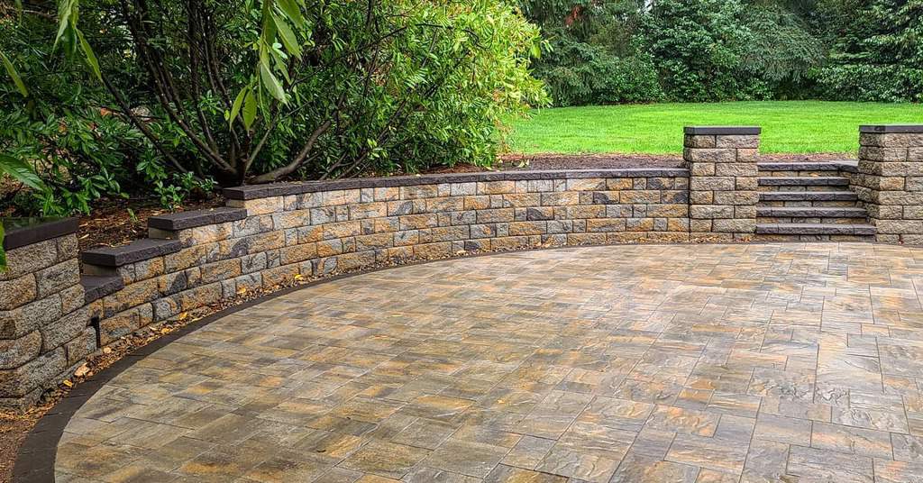 paver patio curved brick wall with steps large grass area 