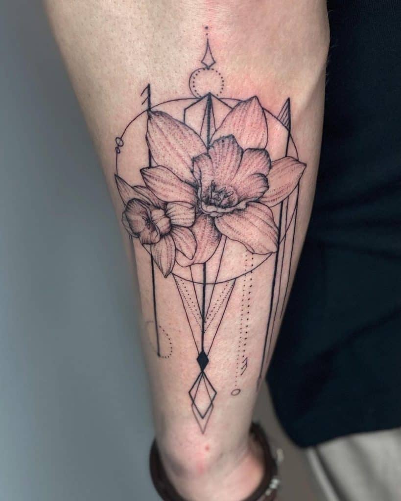 Daffodil Flowers Inside Geometric Circle And Line Framing Delicate Tattoo