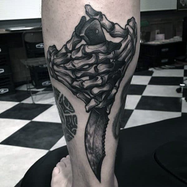Dagger With Skeleton Hands Guys Lower Back Of Leg Tattoos