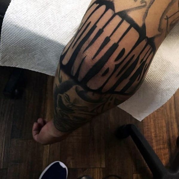 Dallas Cowboys Lettering Guys Elbow Tattoo