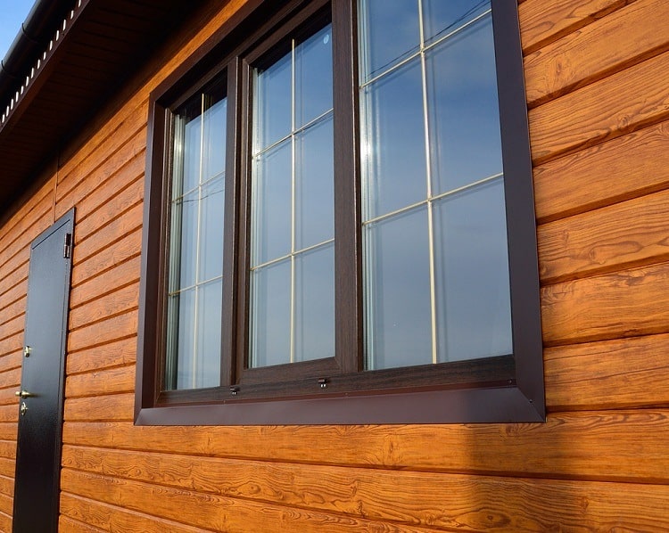 dark brown exterior window trim wood panel wall