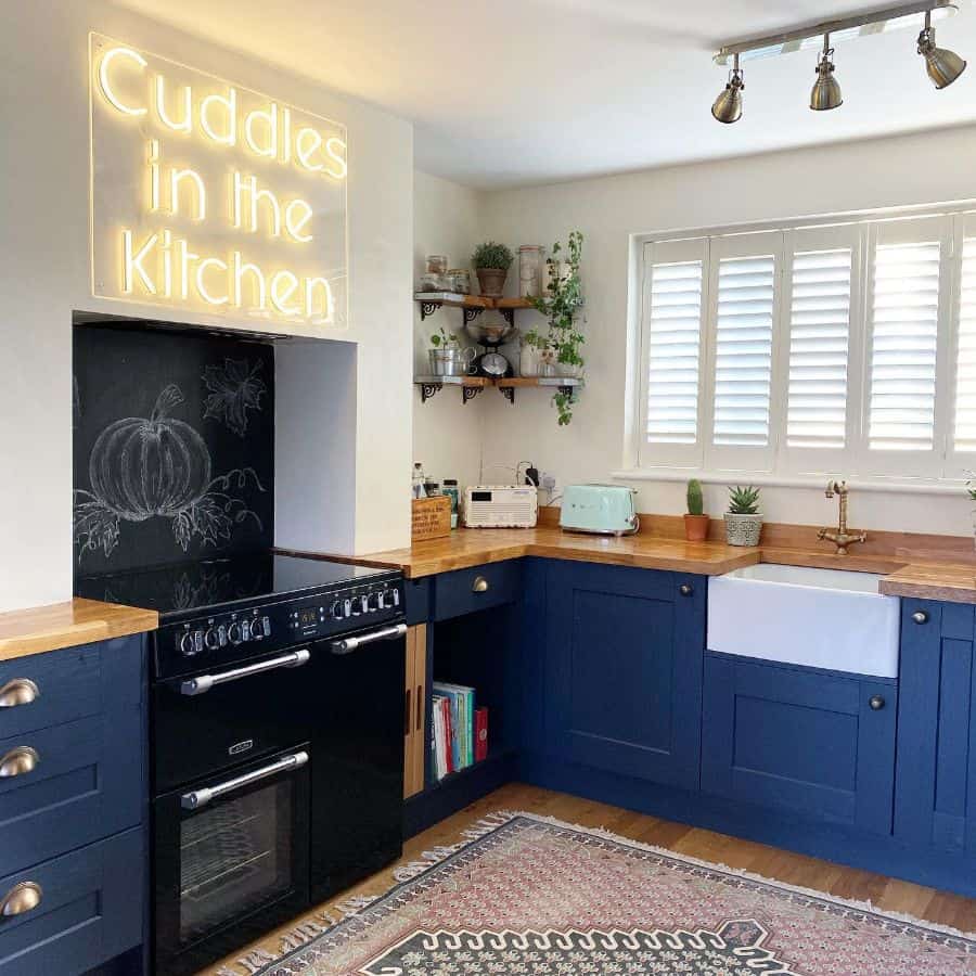 blue cabinet kitchen white apron sink 