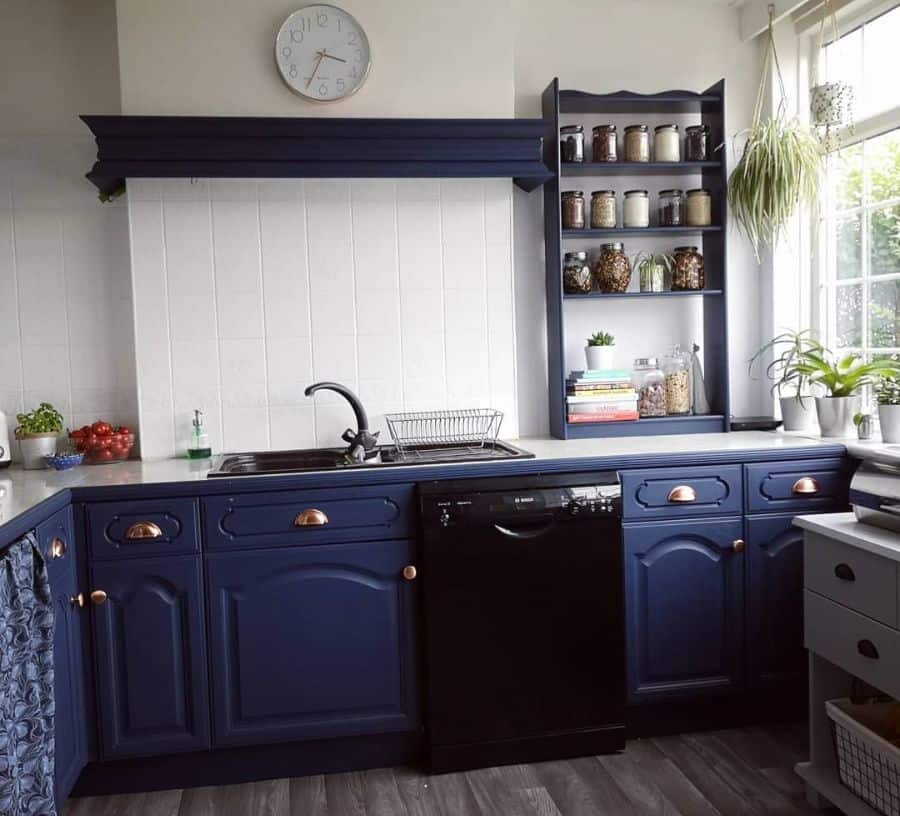 blue cabinet kitchen white tile backsplash 