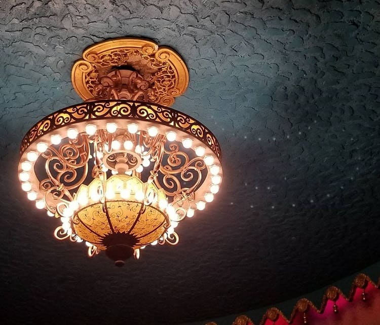 dark color textured ceiling elaborate chandelier