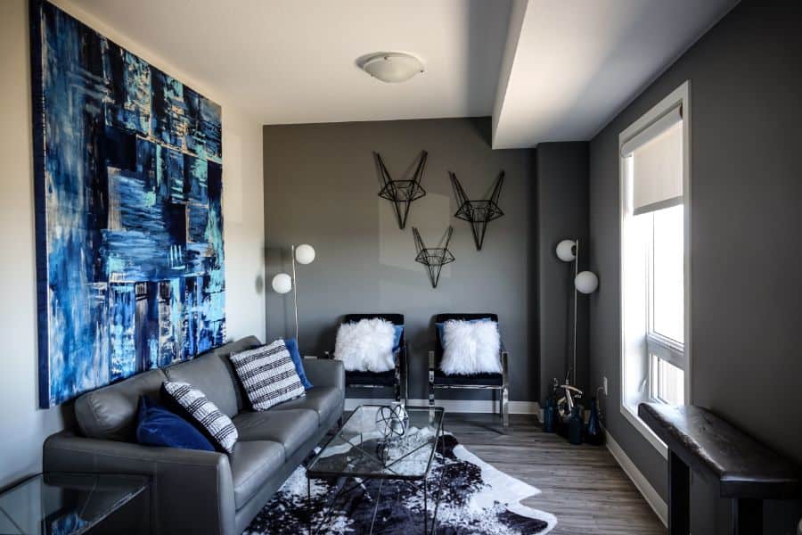 gray living room with blue artwork 