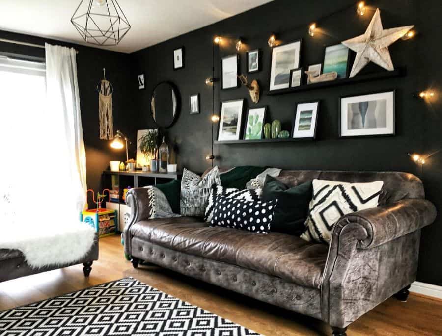 black accent wall in small living room with vintage sofa 
