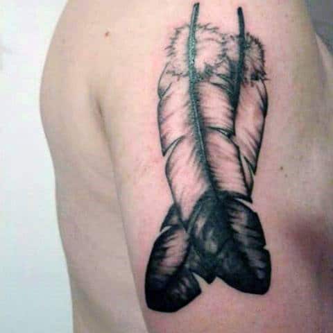 Dark Overlapping Feather Tattoo On Arms For Men