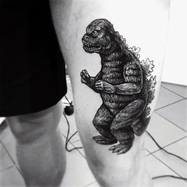 Dark Shaded Godzilla Tattoo On Mans Leg