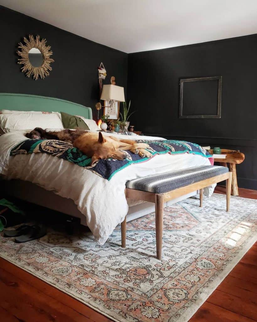 dark small master bedroom with green bed frame
