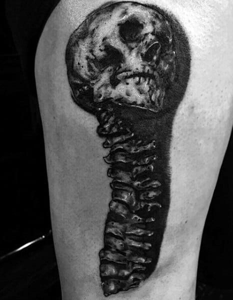 Dark Thigh Spine Tattoo With Skull On Man